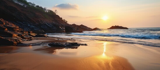 Aufkleber - sun at om beach golden light reflecting on sand sunrise at om beach in gokarna Karnataka. Creative Banner. Copyspace image