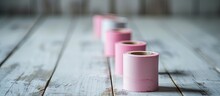 Three Pink Washi Tape Rolls Glued On White Wooden Table Girly Stationery. Creative Banner. Copyspace Image