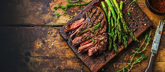 Wall Mural - Medium rare grilled Tomahawk beef steak with asparagus Flat lay with copy space. Creative Banner. Copyspace image