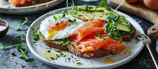 Aufkleber - Toast with salmon poached egg and avocado on a white plate Poached egg with salmon and guacamole on rye bread. Creative Banner. Copyspace image