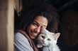 Beautiful young woman holding a white cat in her arms, cradling a newly adopted cat in her arms at an animal shelter. Generative AI