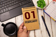 February 1 calendar date text on wooden blocks with customizable space for text or ideas.