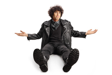 Sticker - Young man in a leather jacket sitting on ground and gesturing with hands