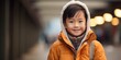© VALUEINVESTOR - an asian boy wearing a jacket smiling, generative AI