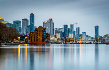 Wall Mural - View of skyscrapers in London city as seen from Surrey docks, England