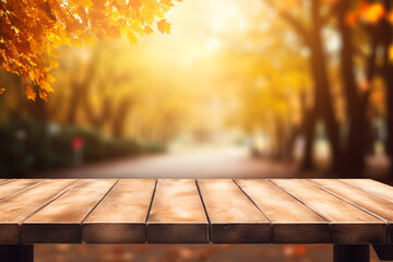 Wall Mural - Empty wooden top table with blurred autumn background.