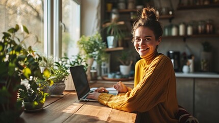 Poster - young smiling pretty business woman student sitting at table at home office with laptop computer loo