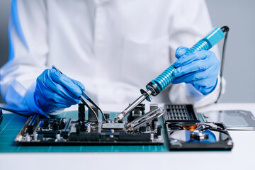 Wall Mural - The technician is putting the CPU on the socket of the computer motherboard. electronic engineering electronic repair, electronics measuring and testing, repair..