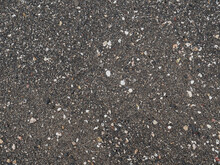 Black Micro Stones And Sea Shells Sand Beach As A Background
