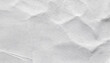 A soft, white, elegant paper texture with delicate creases and fine details, subtly wrinkled paper texture ideal for elegant designs.