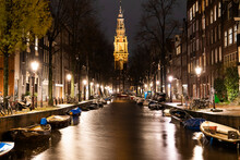 Boats Moored Along Canal Near Zuiderkerk Church At Amsterdam, Netherlands