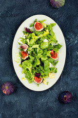 Canvas Print - Salad with figs, herbs and cheese.