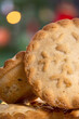 A pile of traditional british mince pies with a typical Christmas style background.