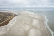 aerial view of sand beach with waves on schiermonnikoog