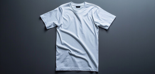 Wall Mural - An empty white t-shirt laid flat against a modern gray background for a clean presentation.