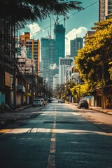 Poster - A city street with tall buildings in the distance. Suitable for urban and architecture themes