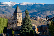 Church Of Sant Vicenç De Saneja And In The Background The City Of Puigcerda In The Area Of Cerdanya In The Province Of Gerona In Catalonia Spain