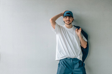 Canvas Print - young man with cap on the street wall