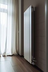 Poster - A white radiator positioned in front of a window. Ideal for home interior design projects