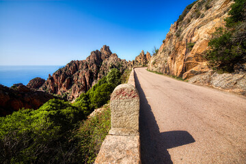 Wall Mural - Milestone on the Road at the Famous Rock Formations Calanques de Piana between Piana and Porto on Corsica, France