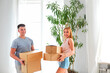 © Dasha Petrenko - Young happy couple in room with moving boxes