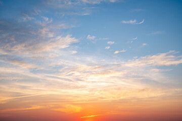 beautiful of luxury soft gradient orange gold clouds and sunlight on the blue sky perfect for the ba