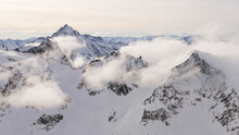 Mystic Snow Covered Mountains With Clouds In Swiss Alps