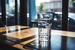 © MirkanRodi - Glass of water on wooden table at the cafe