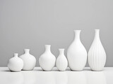 Fototapeta Uliczki - White ceramic vases on a white background. 