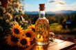 Sunflower oil in a glass bottle and sunflower flowers on a field background
