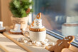 New year celebration. Christmas food white cup with hot chocolate snowman marshmallows and festive decoration. Wintertime concept.