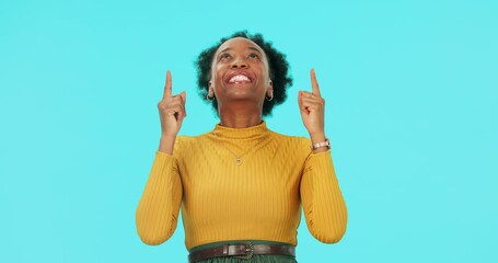 Wall Mural - Face, happy black woman and pointing up in studio isolated on a blue background mockup space. Portrait, funny and African person with hand for advertising, marketing or commercial promotion for brand