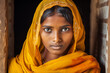 Indian woman wearing yellow veil in local caste fashion