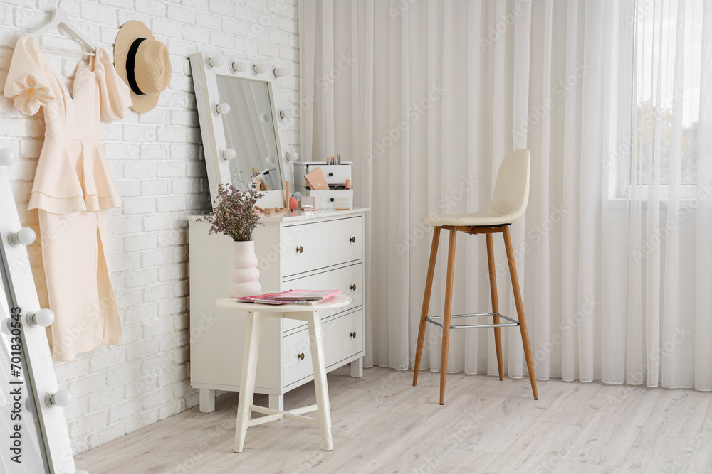 Interior of makeup room with mirror and drawers