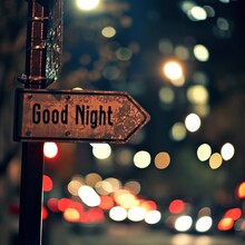 A Photograph Of A Street Sign With The Text Good Night.