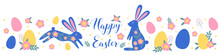  Flat Vector Illustration With Two Blue Bunnies With Flowers And Egg S And Lettering In The Middle. Easter Holiday Symbols, Border, Greeting Card.