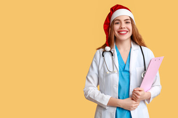 Poster - Young female doctor in Santa hat on yellow background