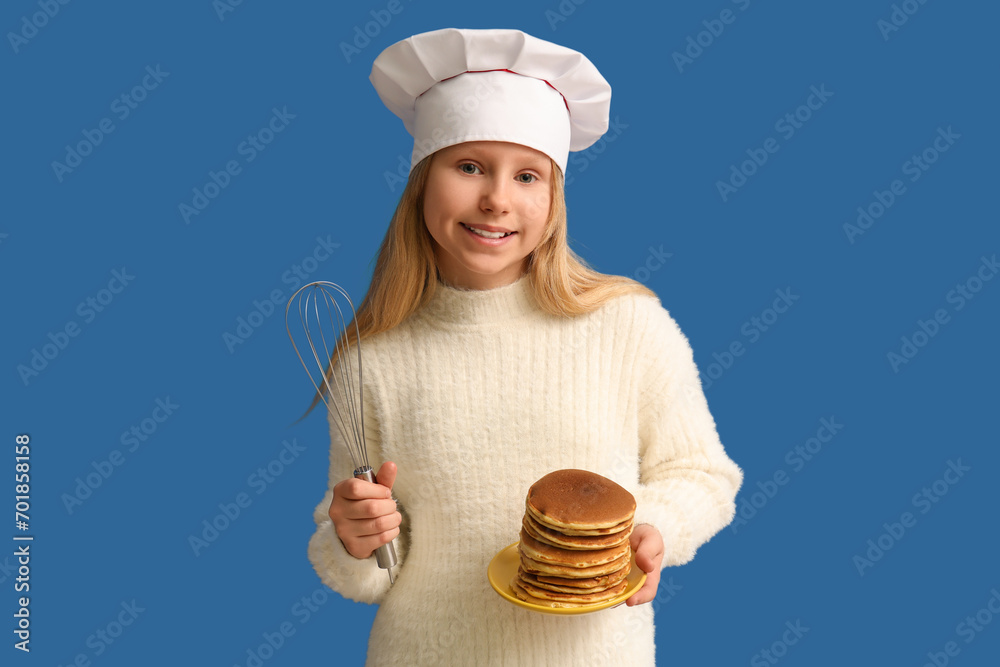 Little chef with tasty pancakes and whisk on blue background
