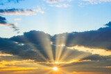 Fototapeta Na sufit - Sunset sky with sunset clouds, sun rays and dramatic sky