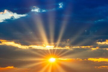 Wall Mural - sunset sky with sunset clouds, sun rays and dramatic sky