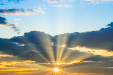 Wall Mural - sunset sky with sunset clouds, sun rays and dramatic sky