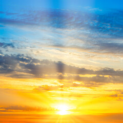 Wall Mural - sunset sky with sunset clouds, sun rays and dramatic sky