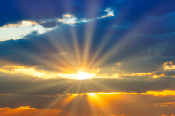 Wall Mural - sunset sky with sunset clouds, sun rays and dramatic sky