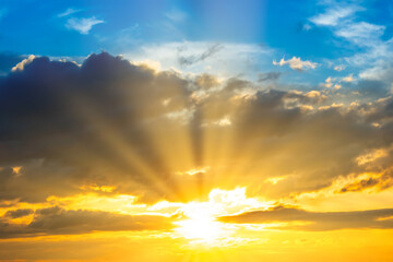 Wall Mural - sunset sky with sunset clouds, sun rays and dramatic sky