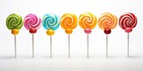 Fototapeta Tęcza - Many different candies lollipop on a white background. Sweet candy.