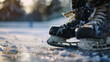 Close Up of Ice Hockey Skates on Frozen Outdoor Rink with Sun Flare