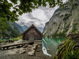 Fototapeta Natura - Berchtesgaden wooden shed at lake which show a nature reflection