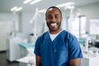 © vasyan_23 - Happy african american man medical assistant in clinic. Nurse in uniform doctor at hospital