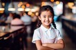 © vasyan_23 - happy asian child girl waiter in restaurant, cafe or bar