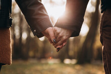 Cropped Image Hands Young Loving Couple Pinky Swear, Pinky Promise Hook Each Other's Little Finger, Hugging Smiling Kissing Laughing Spending Time Together. Autumn, Fall Season, Maple Leaves